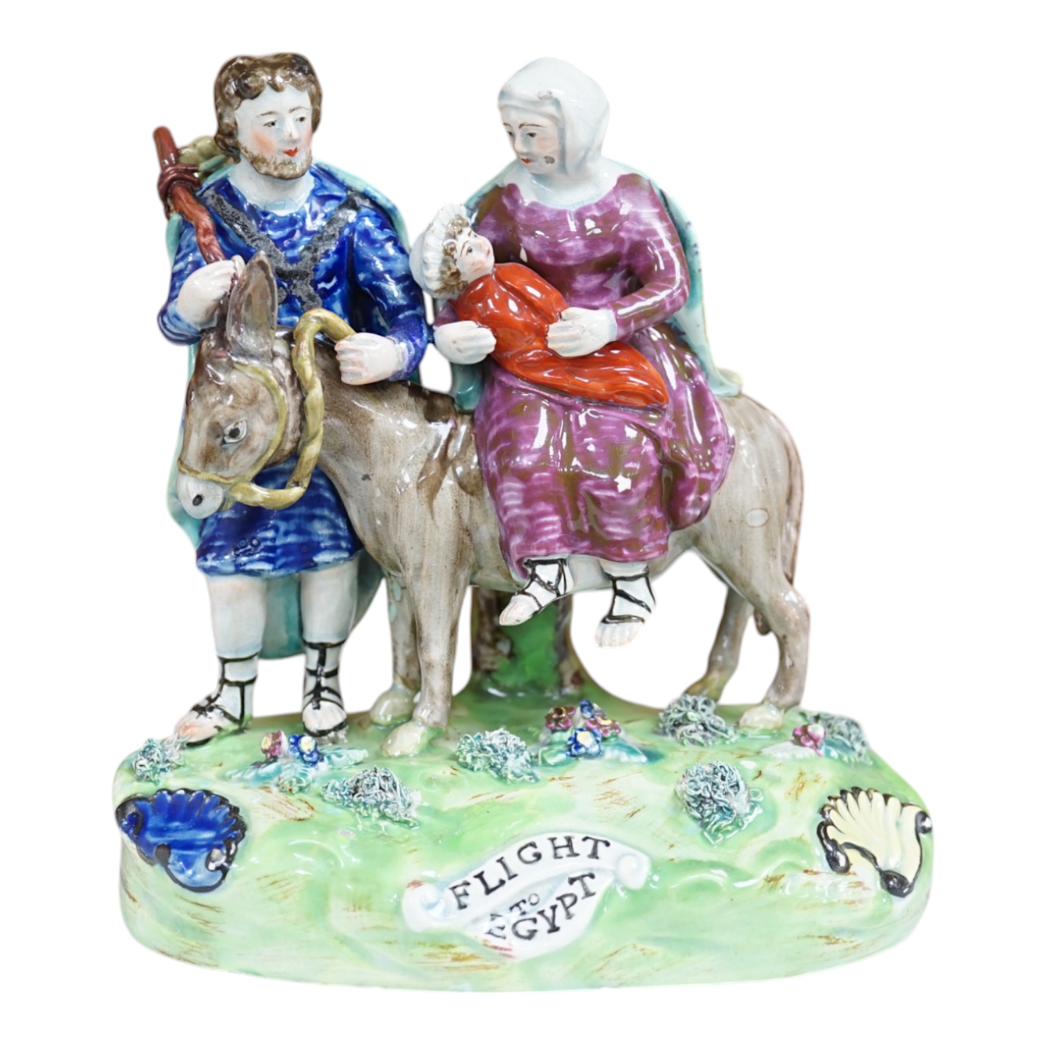 An early 19th century pearlware ‘flight to Egypt’ group, by Walton, 16.5 cm high. Condition - some restoration and bocage lacking